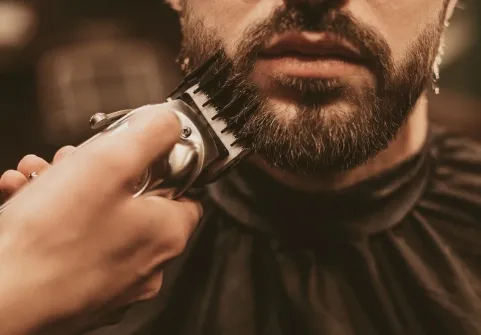 Precision beard trim in the chair