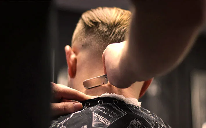Barber finishing a skin fade